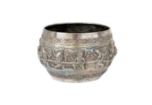 A repousse begging bowl, India, 19th century or later, on plain base engraved with a bird and mar...