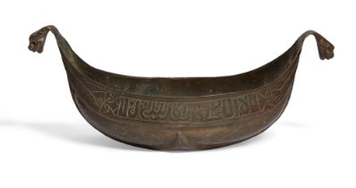 An engraved copper kashkul, Armenia, 19th century, of shallow form, with dragon head terminals, t...