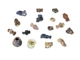 Eighteen miniature Roman glass vessels and amulets, Circa 1st-4th Century A.D., including a pale ...