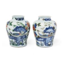 A pair of Chinese wucai baluster jars Transitional period, circa 1640 The thickly-potted bodies...