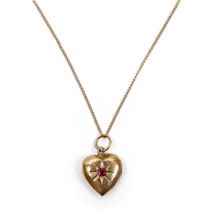 A Chinese gold ruby-inset heart-shaped pendant Early 20th century  The hollow pendant shaped as...