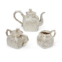 A Chinese silver 'bamboo' three piece tea set  Late Qing dynasty, circa 1900 Comprising: teapot...