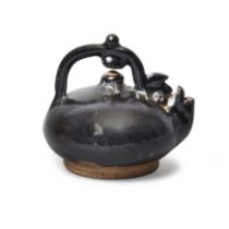 A Chinese black-glazed water dropper 20th century Of compressed globular form, with high loop h...