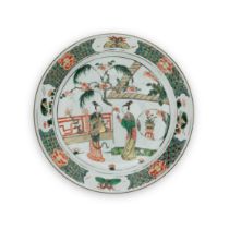A Chinese famille verte 'ladies' dish Qing dynasty, Kangxi period Enamelled to the centre with ...