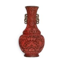 A Chinese cinnabar lacquer wall vase Qing dynasty, 18th century Delicately carved to the lower ...