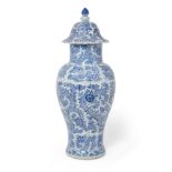 A Chinese blue and white moulded 'floral' baluster vase and cover Qing dynasty, Kangxi period T...