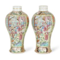 A pair of Chinese Canton baluster vases Qing dynasty, 19th century Decorated with two large pan...