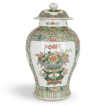 A large Chinese famille verte jar and cover Qing dynasty, 19th century Set to the body with two...