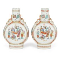 A pair of Chinese famille rose moonflasks Qing dynasty, 19th century Painted with attendants se...