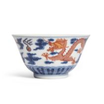 A Chinese iron-red and underglaze blue 'dragon' bowl Qing dynasty, Xuantong mark and period Pai...