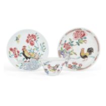 A Chinese famille rose 'chicken' cup and two saucers Qing dynasty, 18th century The cup painted...