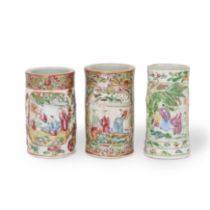 Three Chinese Canton famille rose reticulated brush pots Qing dynasty, 19th century Decorated w...