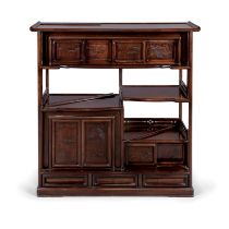 A Chinese hongmu shaped cabinet 20th century The shaped cabinet with asymmetrical shelving, wit...