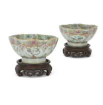A pair of Chinese famille rose lobed bowls 20th century Each rising from a tall straight foot t...