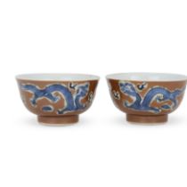 A pair of Chinese cafe-au-lait and blue 'dragon' bowls Qing dynasty, 19th century, apocryphal Ka...