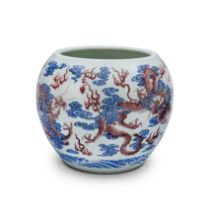 A large Chinese underglaze red and blue and white 'dragon' jardinière 20th century Painted in t...