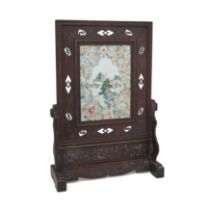 A Chinese famille rose and hardwood table screen Late Qing dynasty The porcelain plaque decorat...