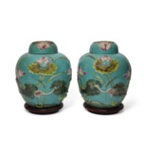 A carved and applied famille rose 'lotus pond' jars and covers Republic period, apocryphal Wang ...