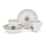 A pair of Chinese export famille rose armorial coffee cups and saucers Qing dynasty, 18th centur...
