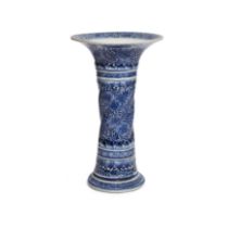 A Chinese blue and white fluted 'floral' beaker vase, gu Qing dynasty, Kangxi period Rising fro...