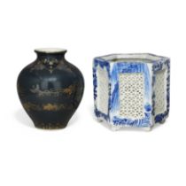 A Japanese Kutani gilt decorated vase and a blue and white jardinière Meiji period The vase ove...