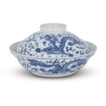 A Chinese blue and white ogee-shaped ‘dragon’ bowl and cover  Qing dynasty, Guangxu mark and per...