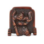 A Japanese wood netsuke of a screen flanked by an oni and a guardian Edo/Meiji period, 19th cent...