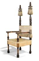 Carlo Bugatti (1856-1940)  Fringed throne armchair dominated by two carved wooden columns adorne...