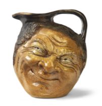 Martin Brothers  Double-sided face jug, 1882  Salt glazed stoneware  Underside inscribed '4.4.82...