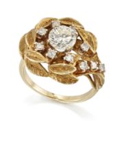 A diamond cluster ring, of flowerhead design, the central brilliant-cut diamond weighing approxim...