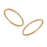 A pair of diamond set bangles, each bangle composed of a continuous row of brilliant-cut diamonds...