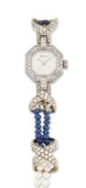 Delaneau. An 18ct white gold, diamond, sapphire and cultured pearl bracelet watch (AF) Circa 1980...