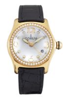 Corum. An 18ct gold diamond set quartz calendar wristwatch Bubble, Ref: 39.151.65, circa 2000 Qua...