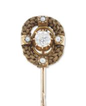 A Victorian diamond, seed pearl and hairwork memorial stick pin, a claw set old European cut diam...