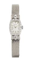 Vertex. A platinum and diamond set manual wind tonneau shaped bracelet watch  Circa 1955 17 jewel...