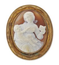 A 19th century gilt mounted shell cameo brooch, the oval cameo depicting a mother and infant, wit...