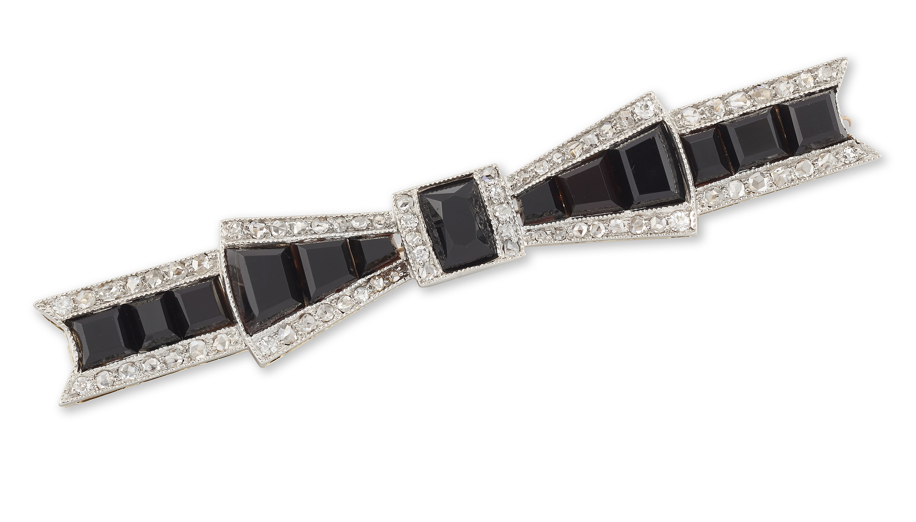 An Art Deco onyx and diamond bow brooch, of typical geometric design set with graduated calibré b...