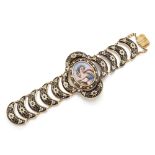 A late 19th century Swiss gold and Swiss enamel bracelet, with central oval Swiss painted enamel ...