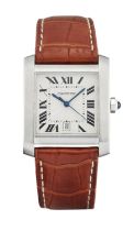 Cartier. A stainless steel automatic calendar wristwatch together with box and papers  Tank Franç...