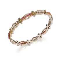 A diamond, ruby and emerald bangle, with sets of brilliant-cut diamonds and round mixed cut rubie...