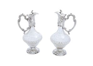 A pair of Continental silver mounted ewers Stamped 0,925 Maker's mark FMT in a shield  The bul...