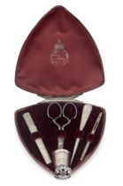 A Victorian silver mounted sewing necessaire Asprey & Co. London, 1881 The triangular-shaped c...