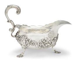 An 18th century silver sauce boat London, c.1760 Maker's mark indistinct The body decorated wi...