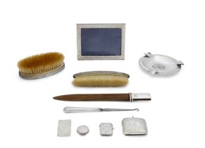 A group of silver and white metal oddments The group comprising: an Italian rectangular photo fr...