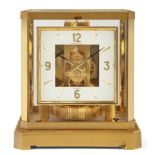 A Jaeger-LeCoultre 'Atmos' mantel clock, c.1977, the brushed brass case with five glass panels, t...