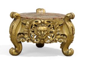 An Italian giltwood stand, last quarter 19th century, with marble top, the carved and pierced fri...