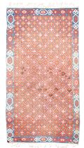 An Indian Dhurrie, 20th century, flat woven with repeating motif on a blue and terracotta ground,...