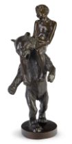 After Josef Müllner, Austrian, 1879-1968, a bronze model of a boy on the shoulders of a bear, mid...