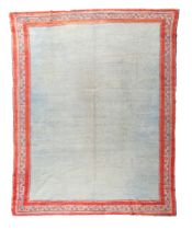 An Anatolian Oushak carpet, second quarter 20th century, the central plain blue field, contained ...