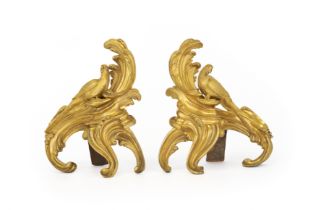 A pair of French gilt-bronze chenets, second half 19th century, each of scrolling acanthus form s...